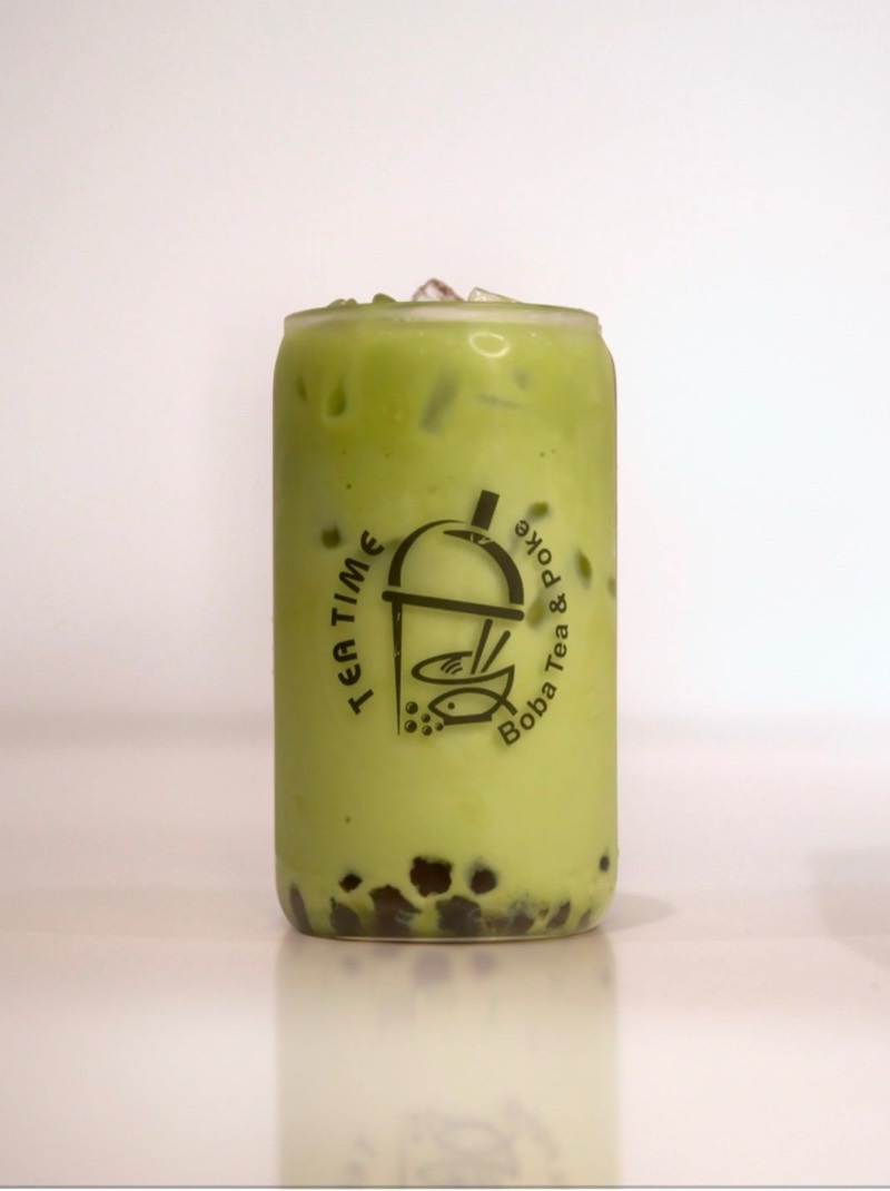 Matcha Lover, layered matcha and milk with boba, in a Tea Time glass