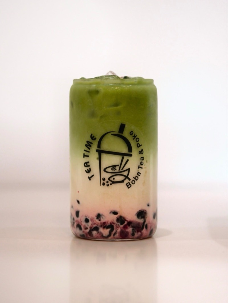 Strawberry matcha latte with boba in a Tea Time glass