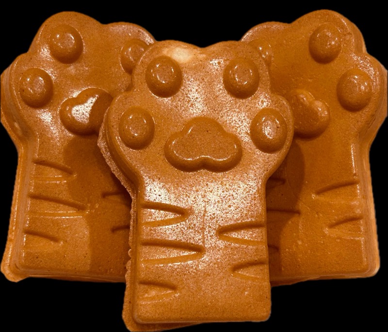 Fresh-baked paw-shaped taiyaki mochi waffles